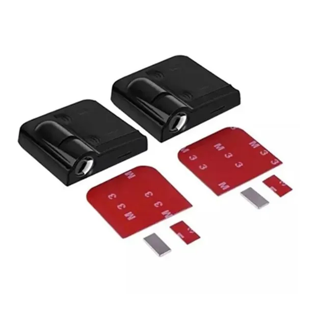 Pair of black rectangular stamp devices with red interchangeable stamping plates and small metal inserts on a white background